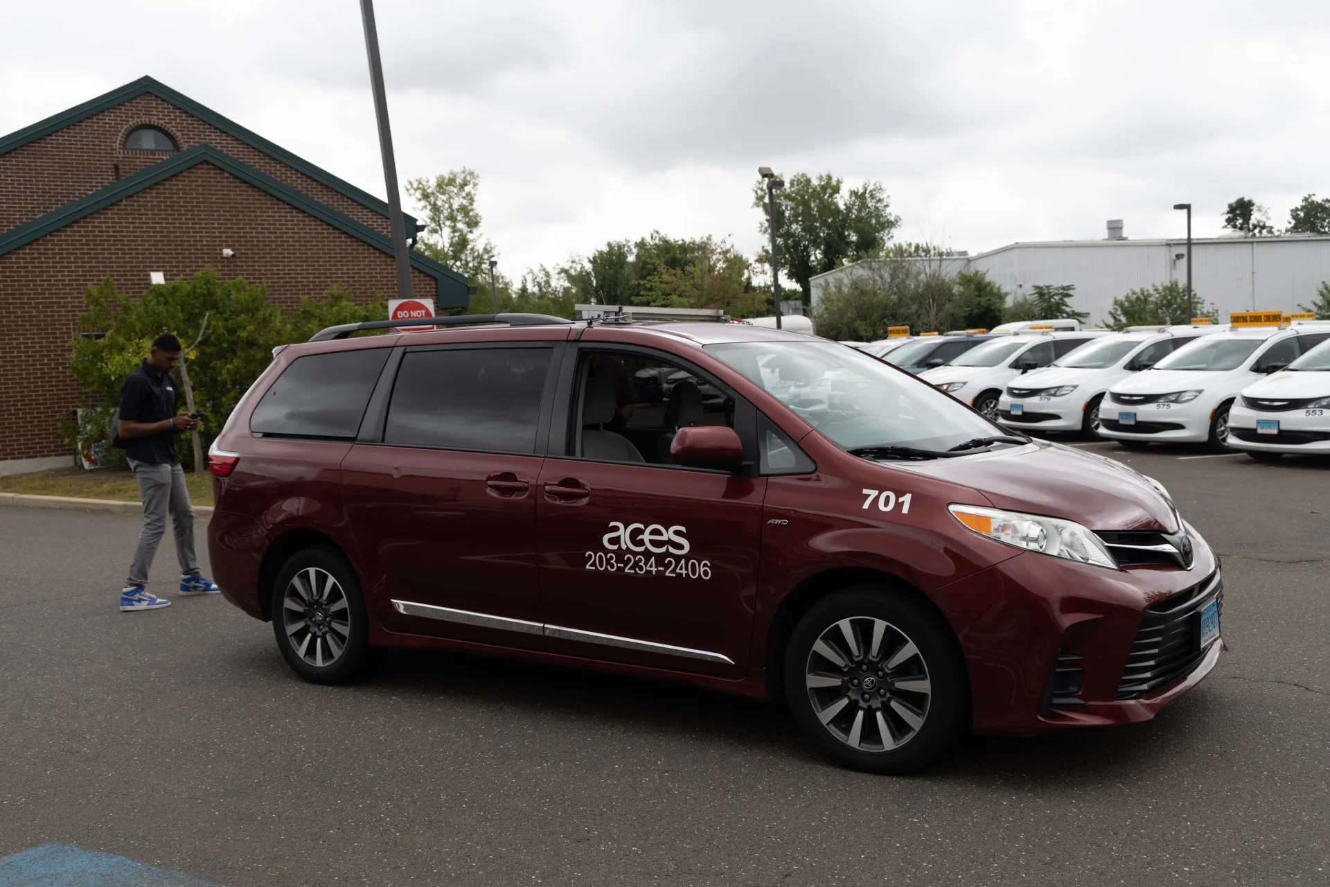 maroon ACES transportation minivan