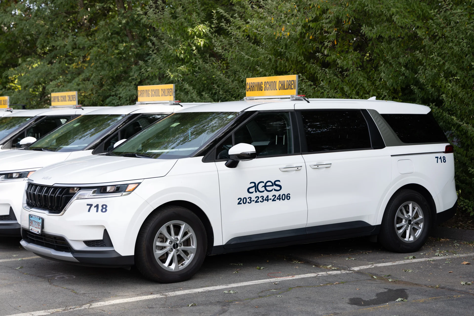 white ACES transportation SUVs