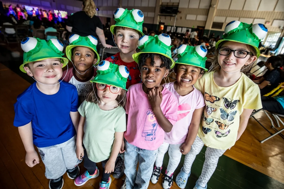 WIMS students dressed in frog hats