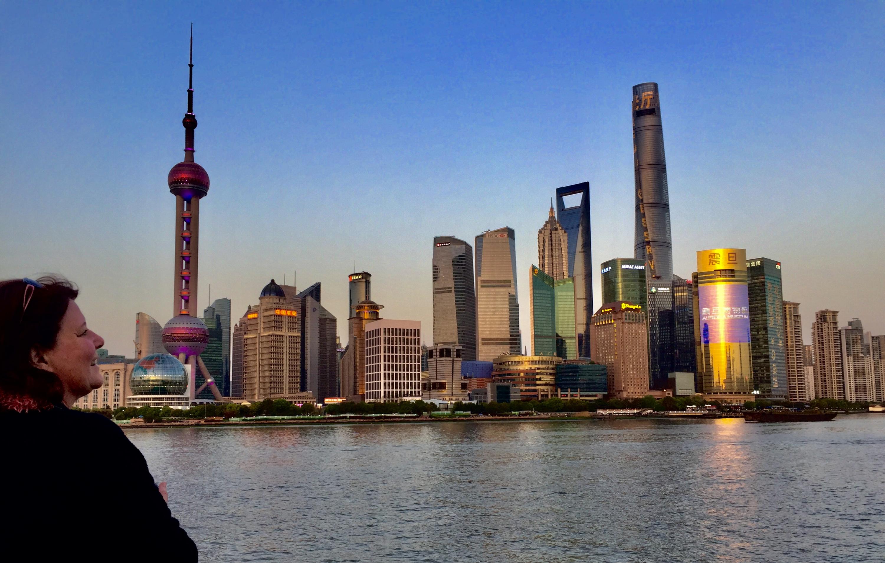 A picture of the Shanghai city skyline at dusk.